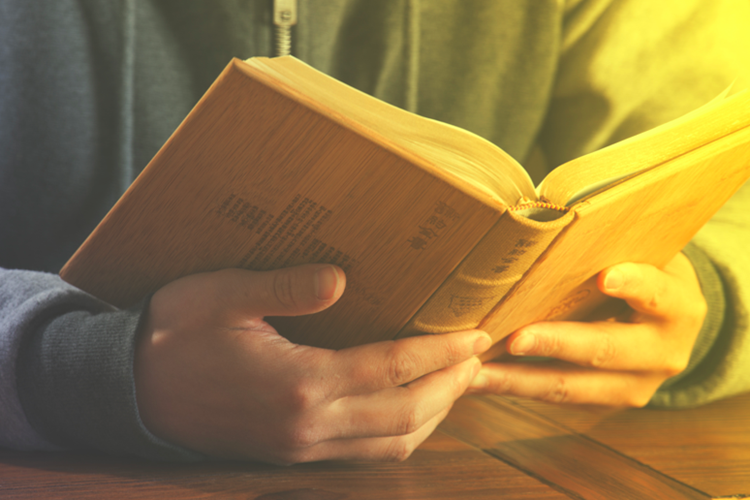 A picture of a person reading the Bible