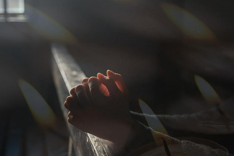 A picture of a person praying