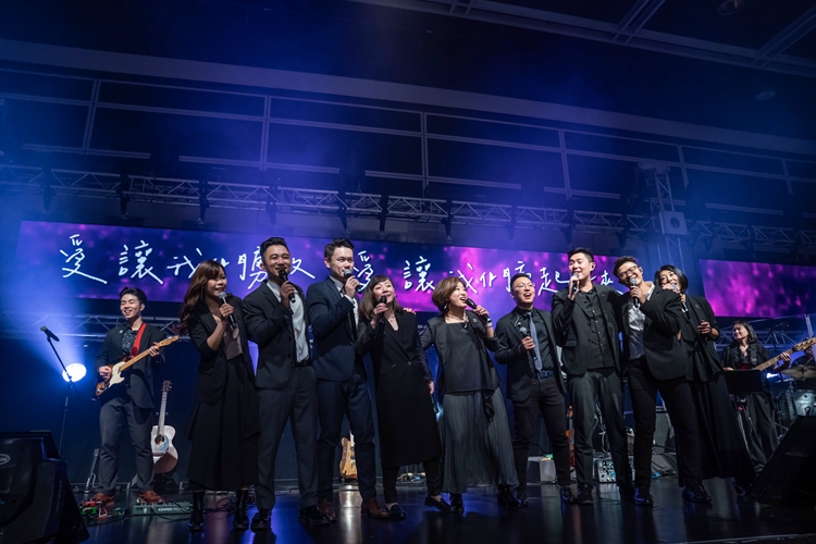 Members from Stream of Praise Music Ministries sang a hymn during a worship revival summit themed 