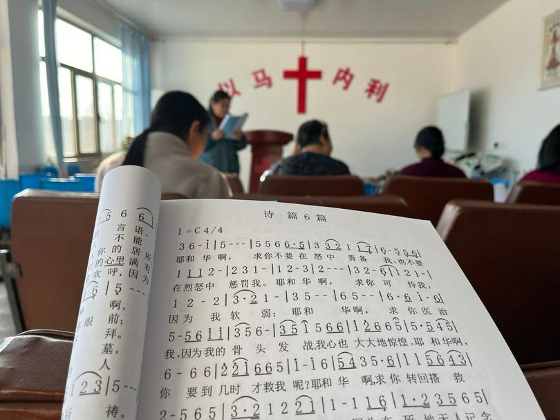 A close-up picture of the sheet music of Psalm 6 in a rural church