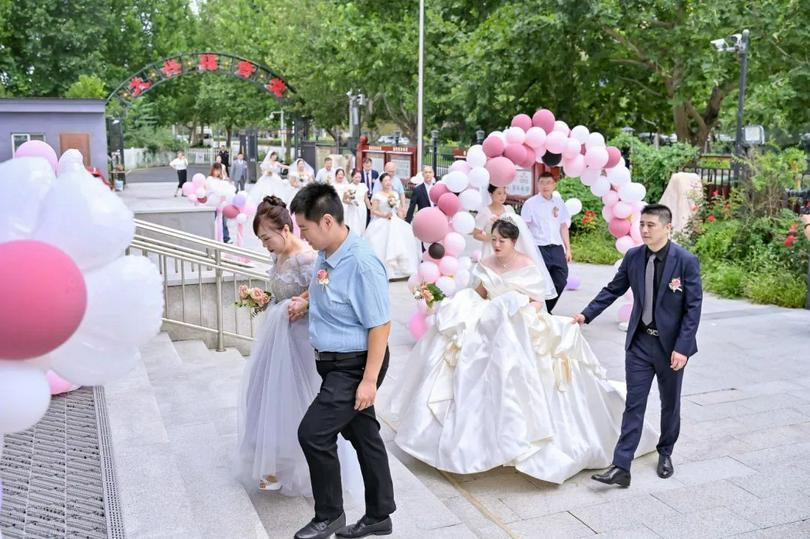 A group photo of Christian couples joining an event renewing marriage vows at the Gospel Church in Daxing District, Beijing, on Chinese Valentine’s Day on August 10, 2024.