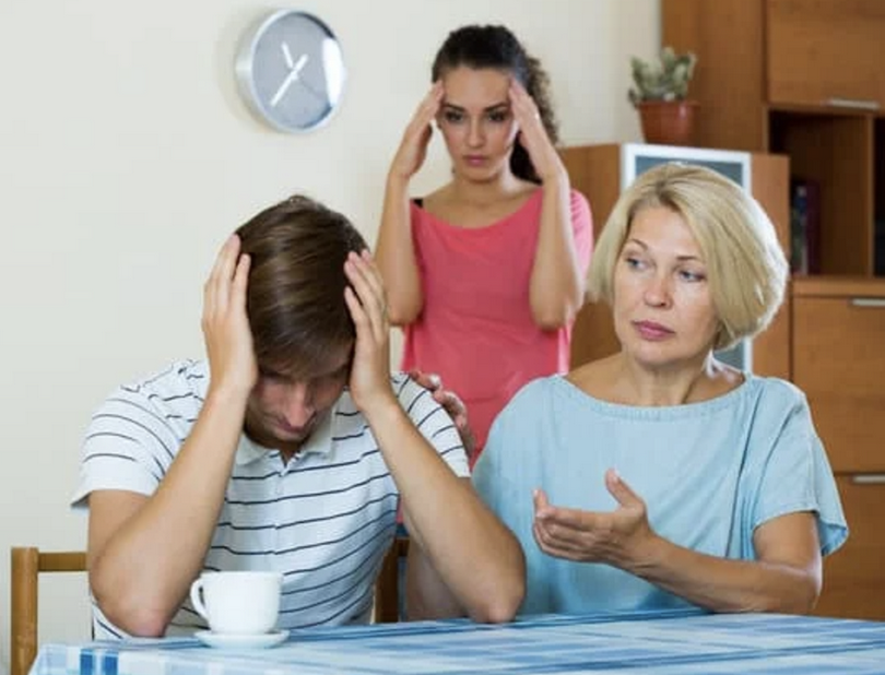 Angry wife and mother-in-law rebuking young man