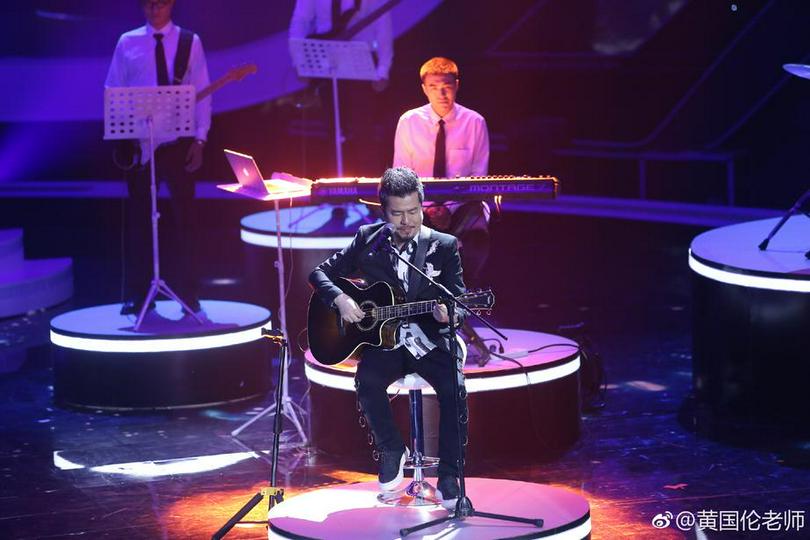 A picture shows Vintz Huang, a Taiwanese artist, playing a guitar on the stage at an unknown date.
