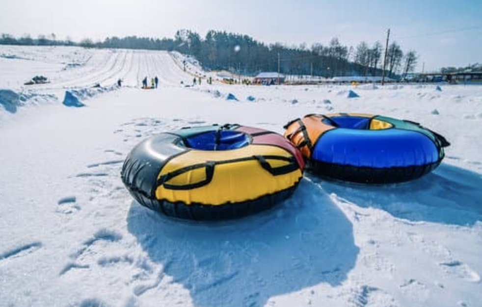 Snow tubing, sleigh on the top of the hill, winter activity