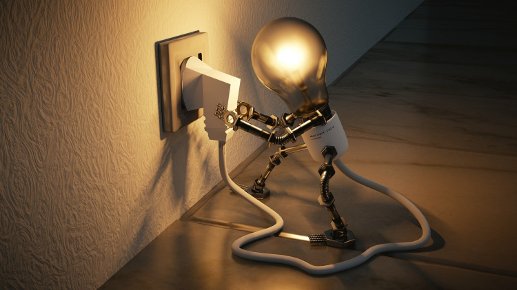 The picture shows a robot-like bulb holding the plug to charge.