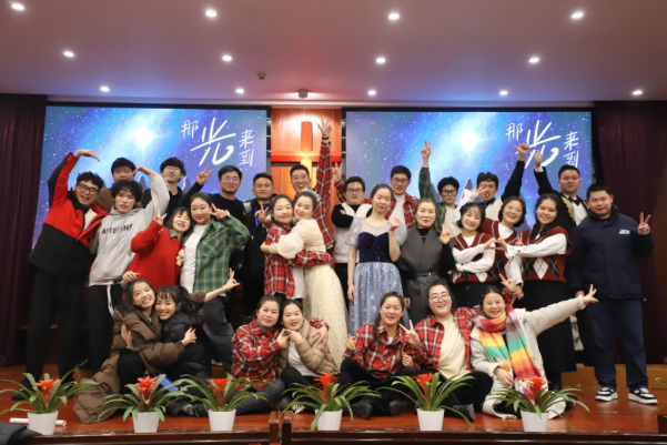 A group photo of students dressed in festive clothes during Christmas celebration at Zhejiang Theological Seminary in Hangzhou City, Zhejiang Province, on 2024 Christmas week.
