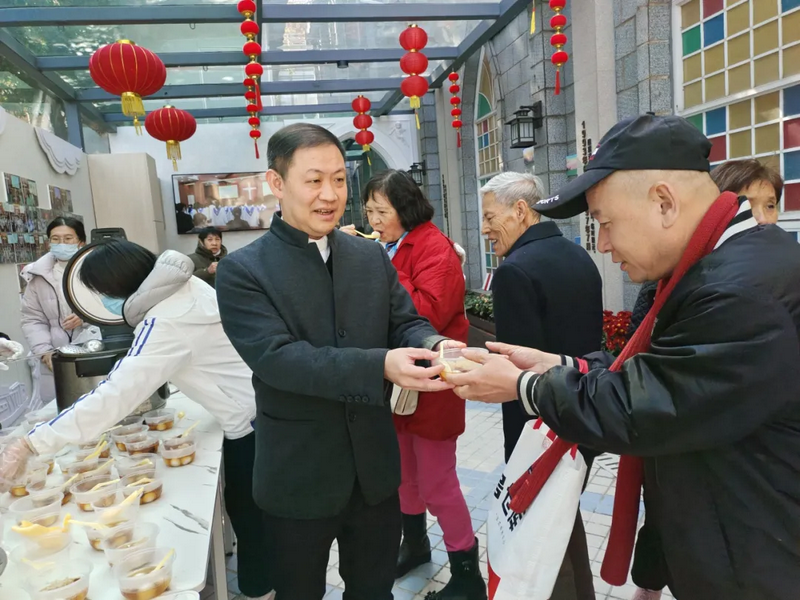A pastoral worker distributed Tangyuan to a believer to mark the Lantern Festival at Fangcun Church in Guangzhou City, Guangdong Province, on February 9, 2025.
