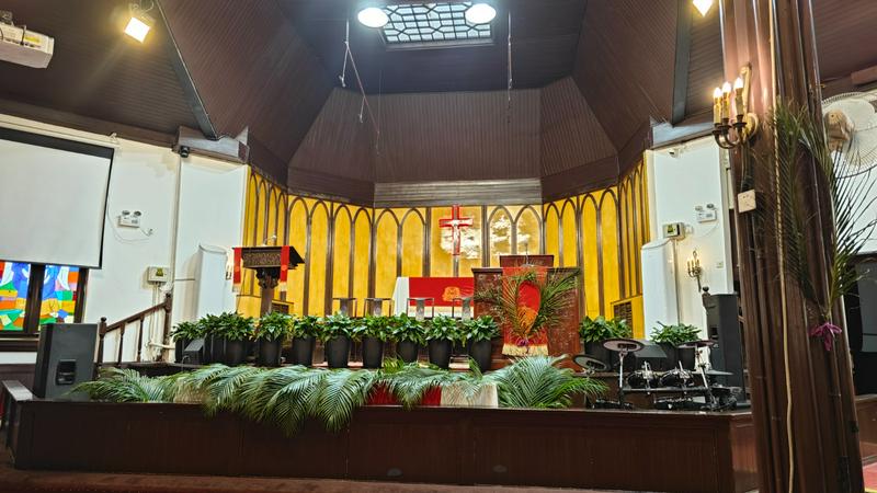 The chapel of Chongwenmen Church in Beijing is decorated with palm branches during Holy Week 2025.
