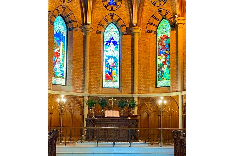 During Holy Week 2025, the altar at the chapel of Holy Trinity Cathedral in Shanghai was adorned with palm branches, candles, and an open Bible.