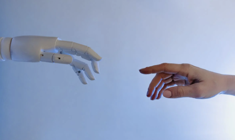 A robot's hand and a human's hand