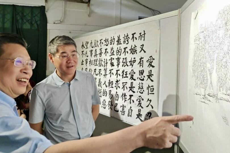 Rev. Cai Jianwei (right), vice chairperson of Guangdong TSPM and vice dean of the Guangdong Union Theological Seminary, and Rev. Guo Yun (left), chairperson of Guangdong TSPM, appreciated artworks exhibited at the Guangdong Union Theological Seminary in Guangzhou City, Guangdong Province, on May 14, 2025.