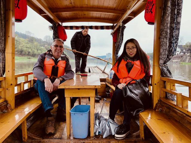 John Holliday toured China by his Chinese guide Joey Zhou on a boat on March 7, 2018.