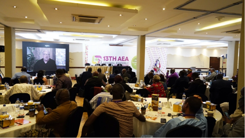 Rick Warren appears on screen via livestream as he addresses participants of the Association of Evangelicals in Africa General Assembly in Nairobi on May 22, 2025.