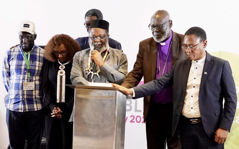 Rev. Dr. Jean Libom Li Likeng, newly elected president of the Association of Evangelicals in Africa (AEA), leads a prayer of commissioning for the second edition of the Africa Bible Commentary during the 13th AEA General Assembly in Nairobi, Kenya.