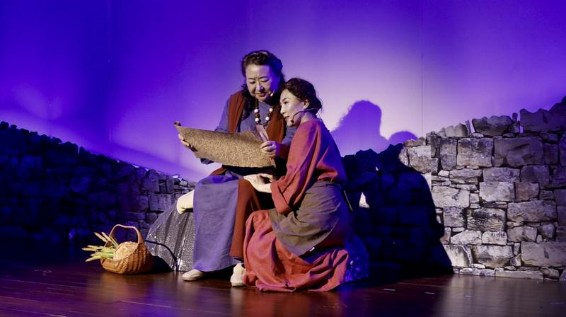 Two Christians acted as Naomi and Ruth, studying the Pentateuch together at night during the musical at Qiaocheng Church in Shenzhen, Guangdong Province, on May 10, 2025.