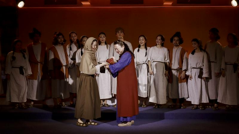 A group of Christians performed the scene of Naomi holding the newborn Obed during the musical at Qiaocheng Church in Shenzhen, Guangdong Province, on May 10, 2025.
