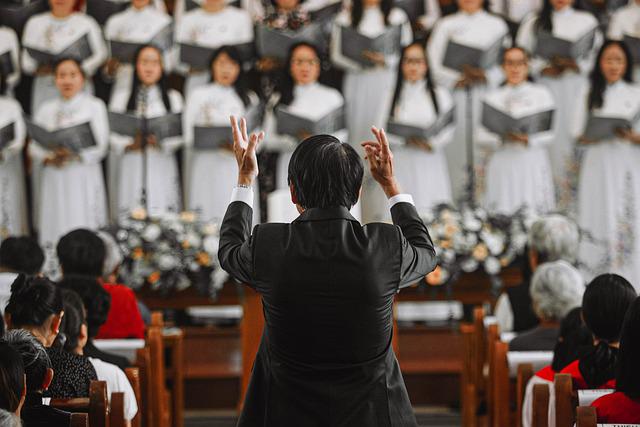 A choir leader directed the church choir during a performance on an unknown day.