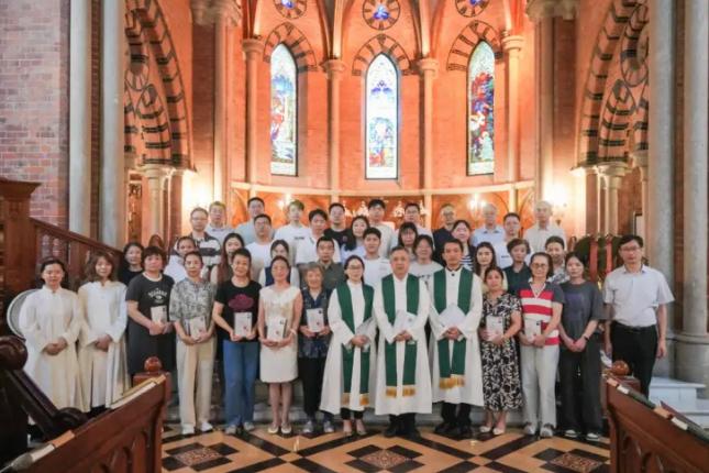 A commemorative photo was taken during a conversion ceremony for 34 seekers at the Holy Trinity Cathedral in Shanghai on July 6, 2025.