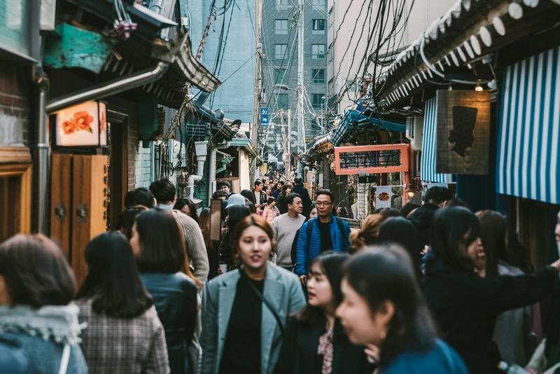 A street in Korea was full of people during the daytime on an unknown day.
