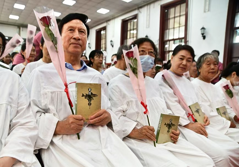 Each newly baptized believer received a Bible and a rose during their baptism service at Gangwashsi Church in Beijing on July 27, 2025.