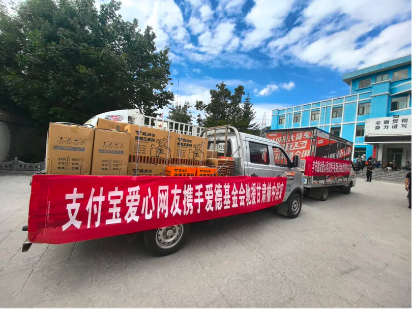 Carts loaded with disaster relief supplies head toward flood-hit areas in Gansu Province in early August 2025.