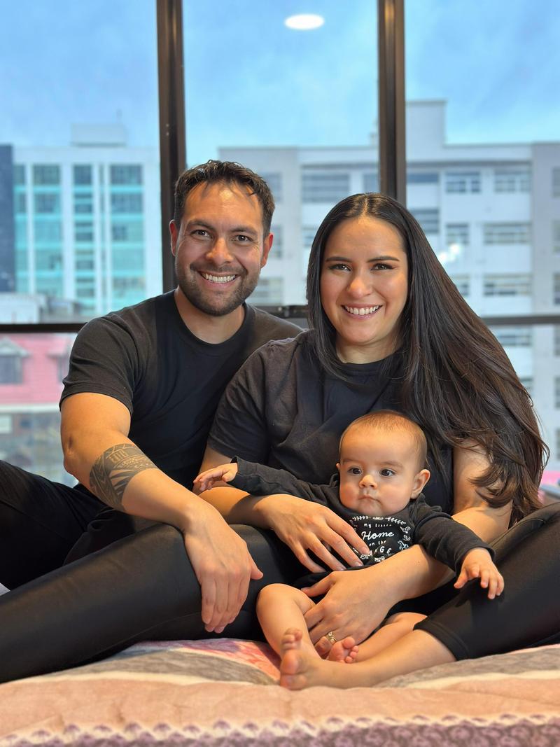 Daniel Cabrera Arakaki, his wife, and son