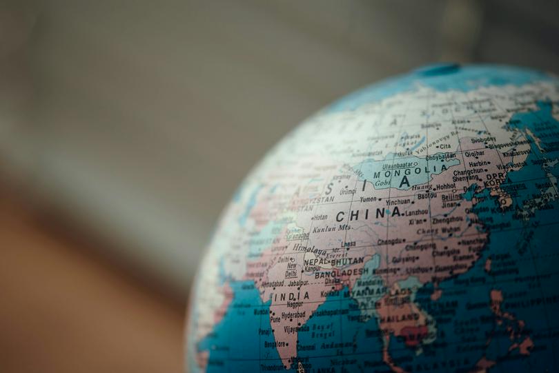 A close up photo of blue desk globe