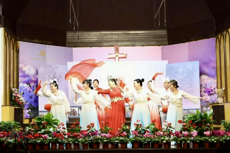 A group of believers performed a dance during the celebration gala for the 155th anniversary of Chongwenmen Church in Beijing on November 16, 2025.