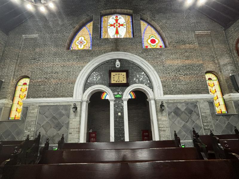 Painted glass on the sanctuary windows inside the Dongxinxiang Church in Xi'an, Shaanxi