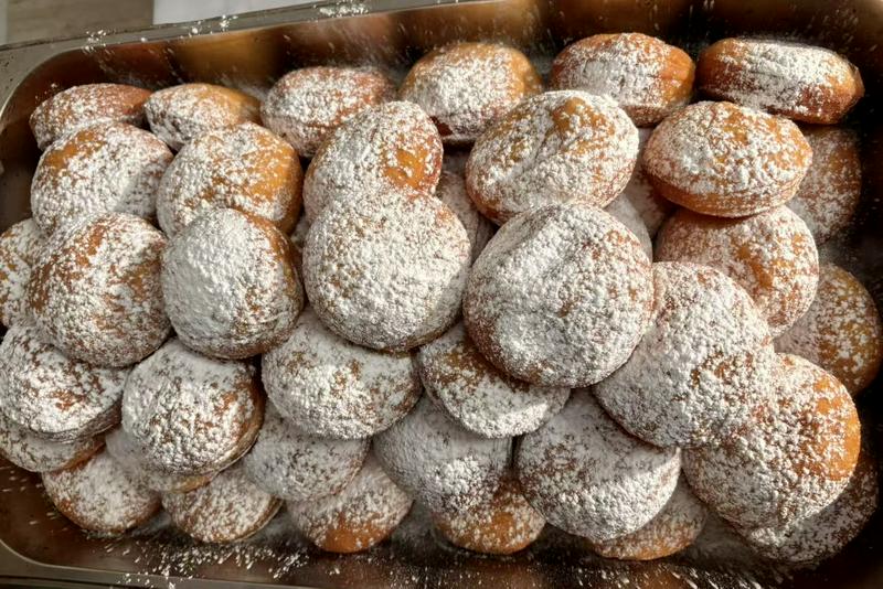 Sufganiyots (round jelly doughnuts) offered at Ravit Baer's residence in Shanghai, on December 17, 2025