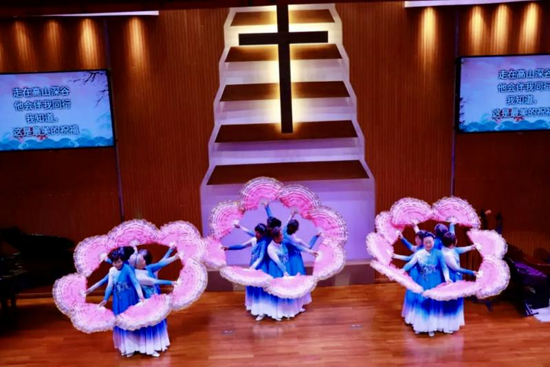 A group of Christian women presented a traditional fan dance performance at a church in Guangdong Province during the Christmas season in December 2025.
