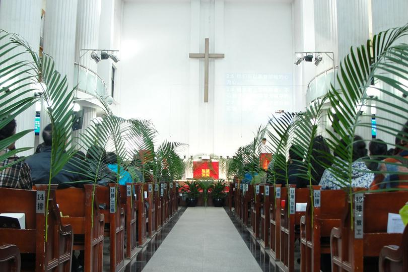 A palm frond is attached on every row in the chapel of Yanjing Theological Seminary to celebrate Palm Sunday