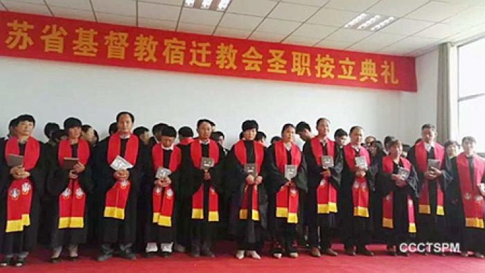 The church staff receive ordination