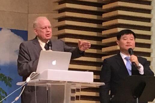 Rev. Dennis Balcombe delivering sermon