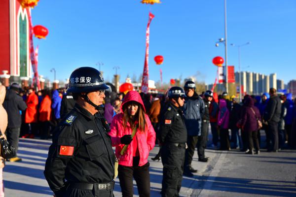 Guards stand beside the church to maintain order