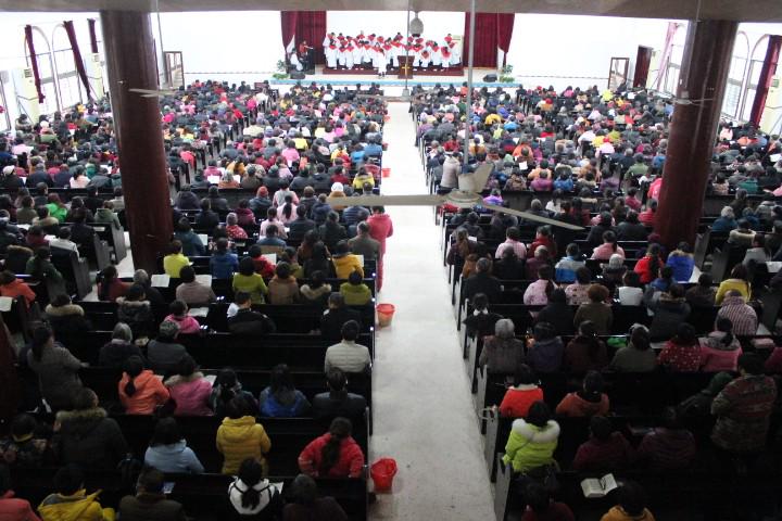 The congregation attends the Sunday service in Gospel Church