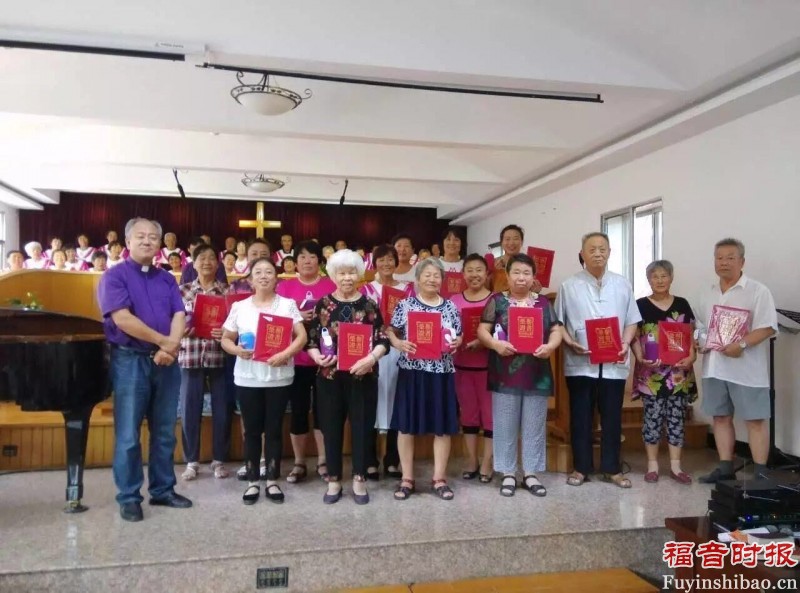 Pastor awarding certificates to Bible Transcription winners