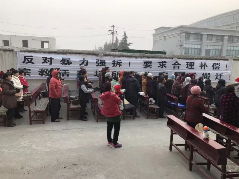 The believers gather at outdoors after Dali Church has been demolished