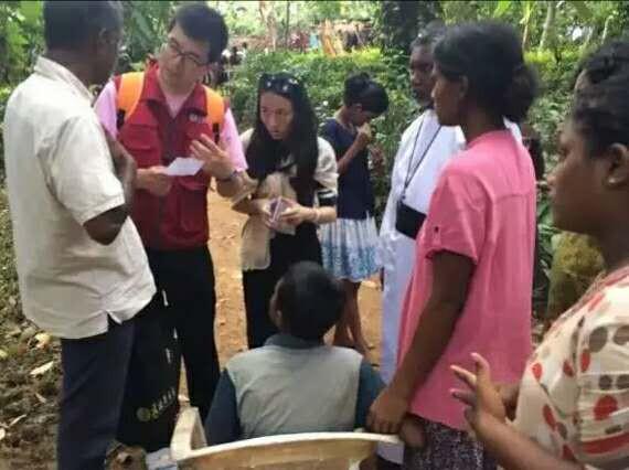 Amity's disaster relief team with the local affected people 