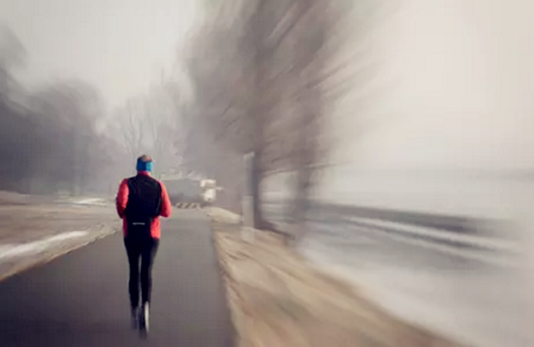 A man runs on the road.