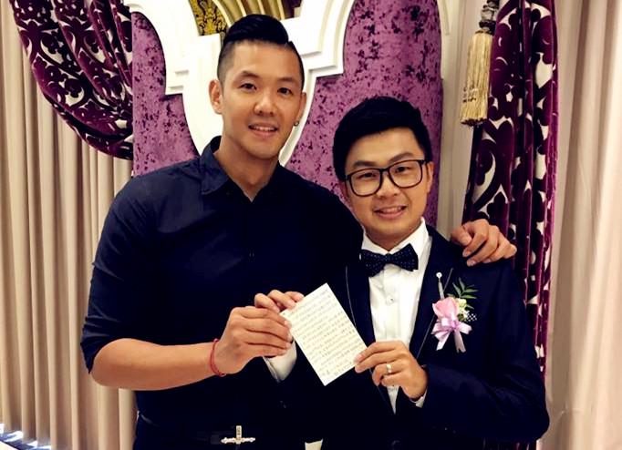 Blackie Chen (left) and Li Jiajun, the bridegroom, held the letter