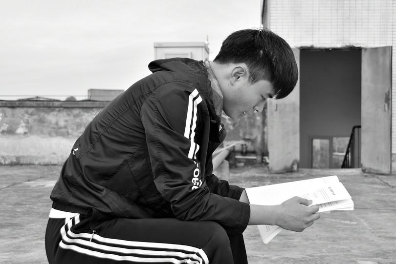 A student reads a book. 