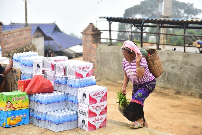 A Christian woman takes vegetable and fruits to the church.