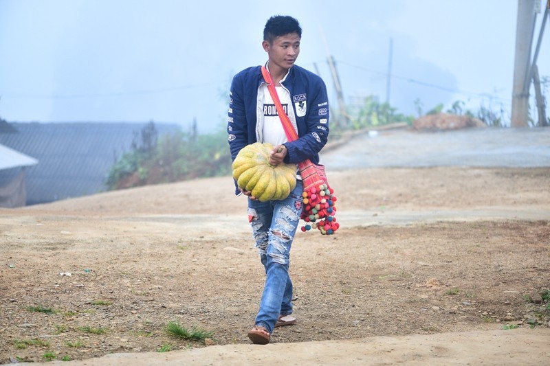 A Christian brother is taking a pumpkin to the church.
