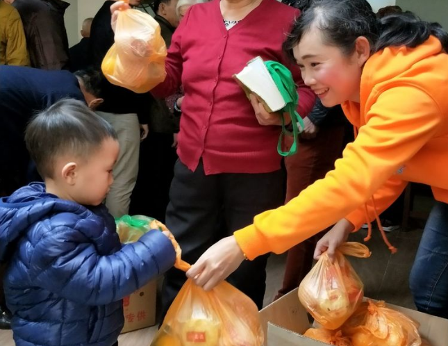 The church staff passed out Christmas gifts to the congregation.