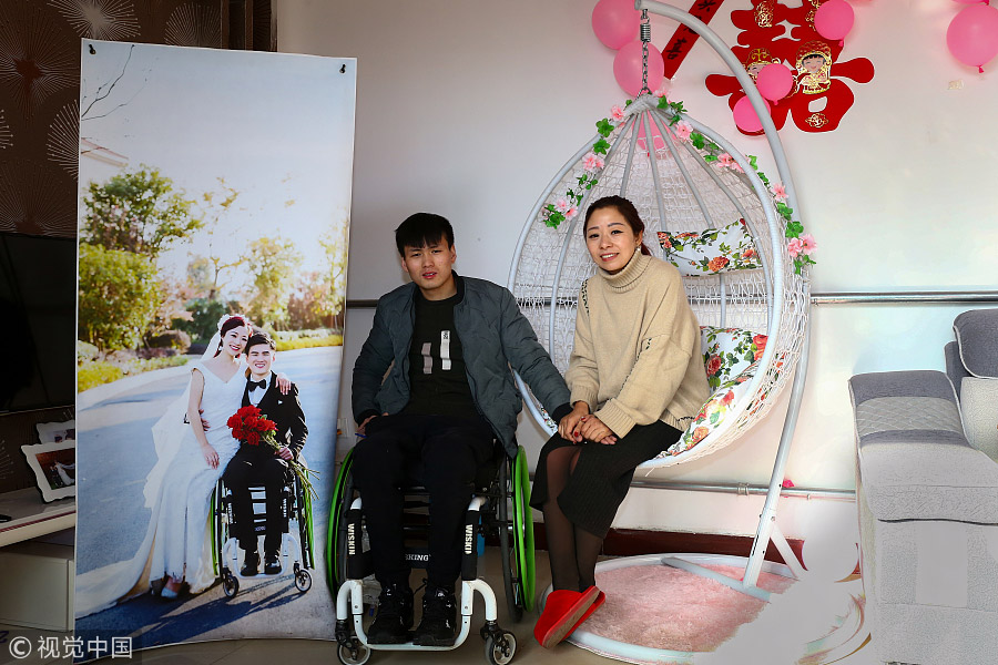 Hao Panpan (left) and Fu Chengjun pose in their wedding room in Huanggou village of Jize county in Handan, North China's Hebei province, Jan 9, 2018.