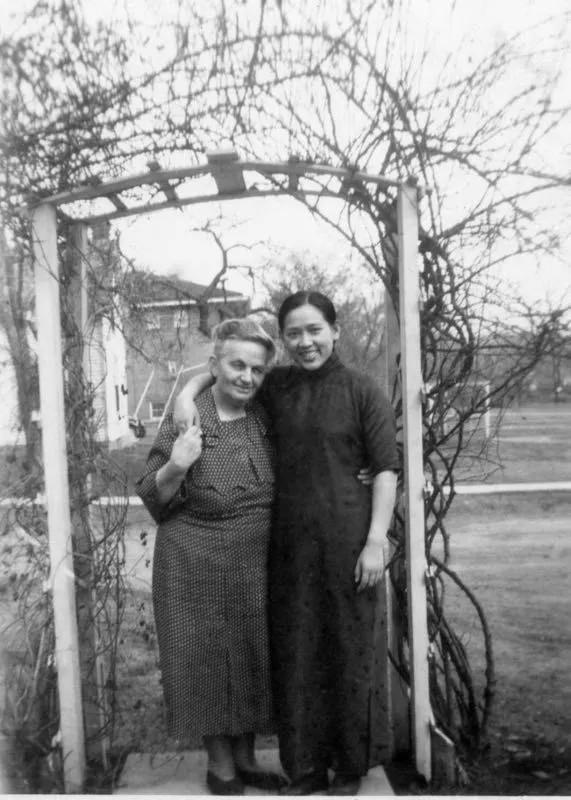 Preacher Zhou Enying, 26, and her adoptive mother