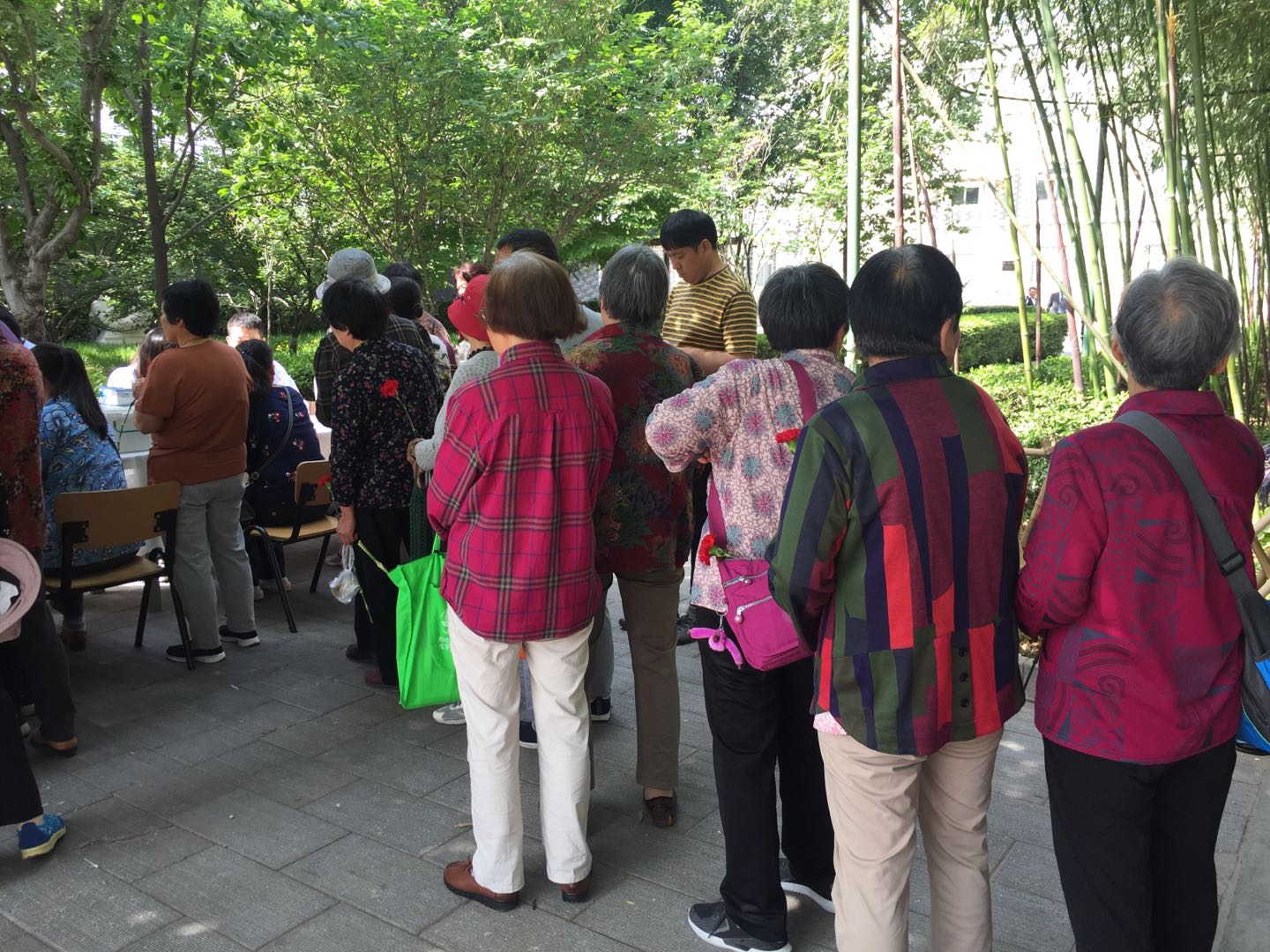 The mothers waited in line to receive the medical service.  
The mothers waited in line to receive the medical service.