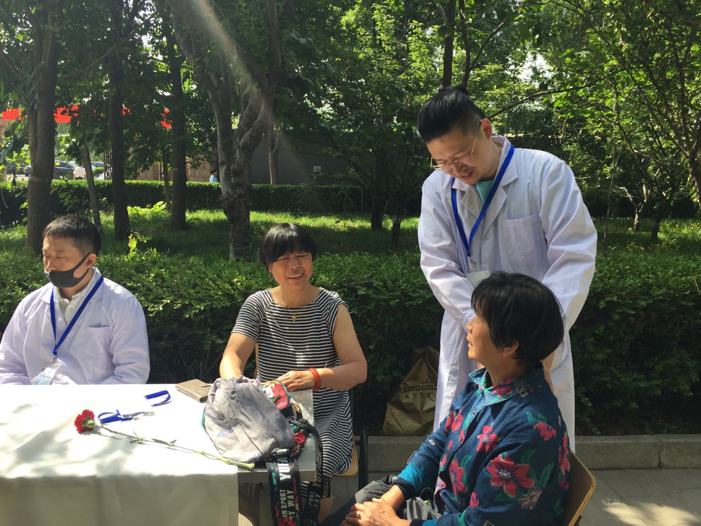 The massagist provided service to the mothers.