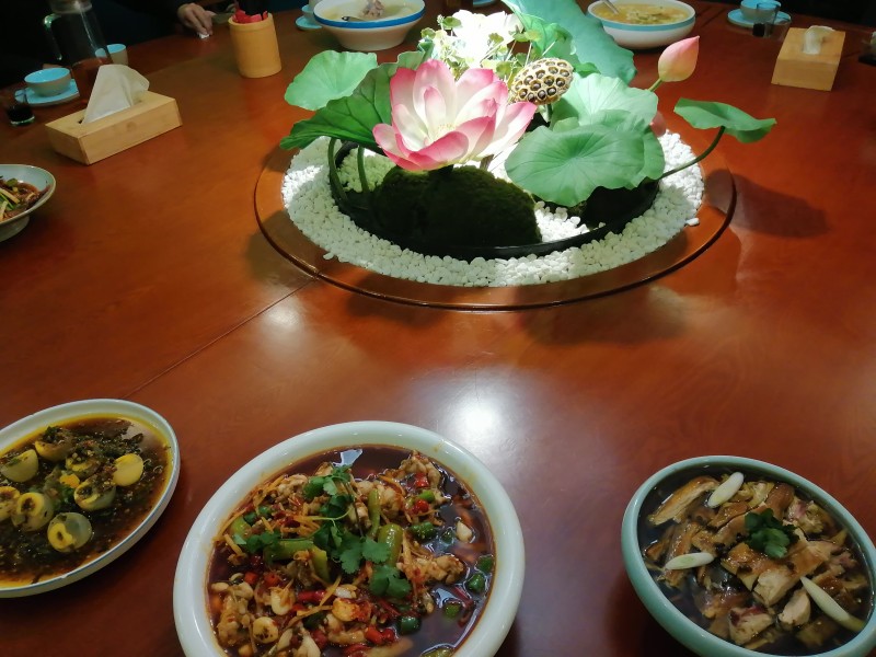 A holy and beautiful lotus and some food were placed in the center of the table for single believers of a church during the 2021 Spring Festival.